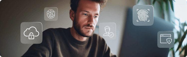 FÃ©rfi laptopon dolgozik, kÃ¶rÃ¼lÃ¶tte felhÅ, AI Ã©s digitÃ¡lis azonosÃ­tÃ¡s biztonsÃ¡gÃ¡t jelkÃ©pezÅ ikonok